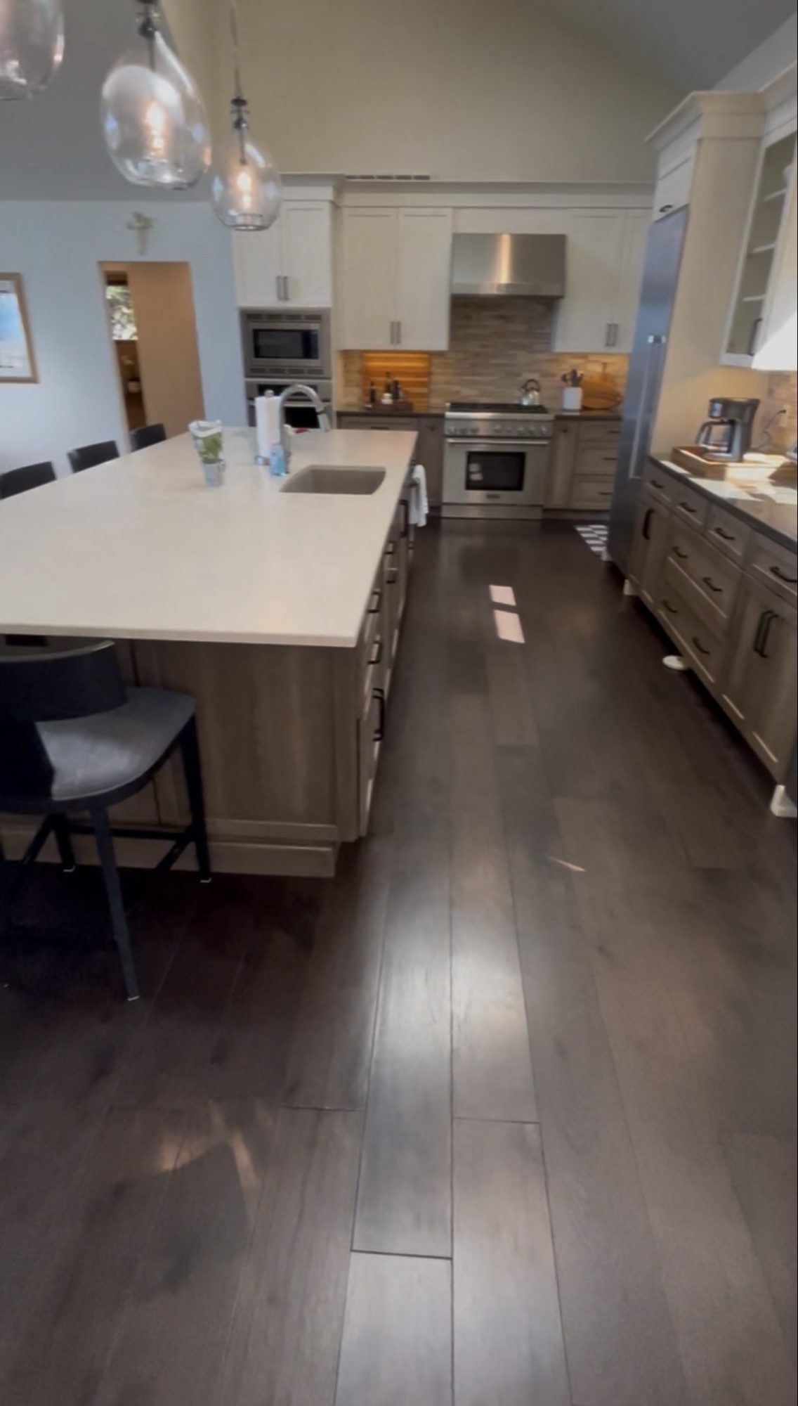 Spacious kitchen with large island and stainless appliances
